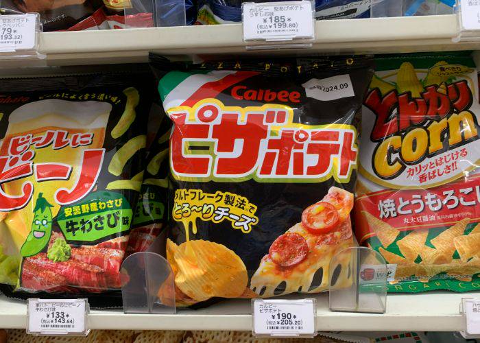 Calbee Chips on a konbini shelf, featuring the pizza flavor at the center.